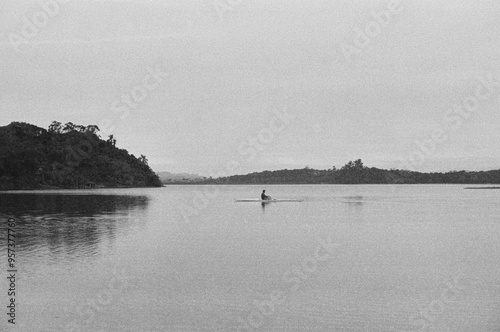 Man rowing in a quiet lake  photo