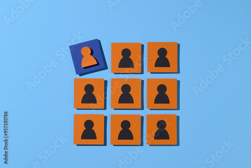 Unique Person Among Group of Identical Figures