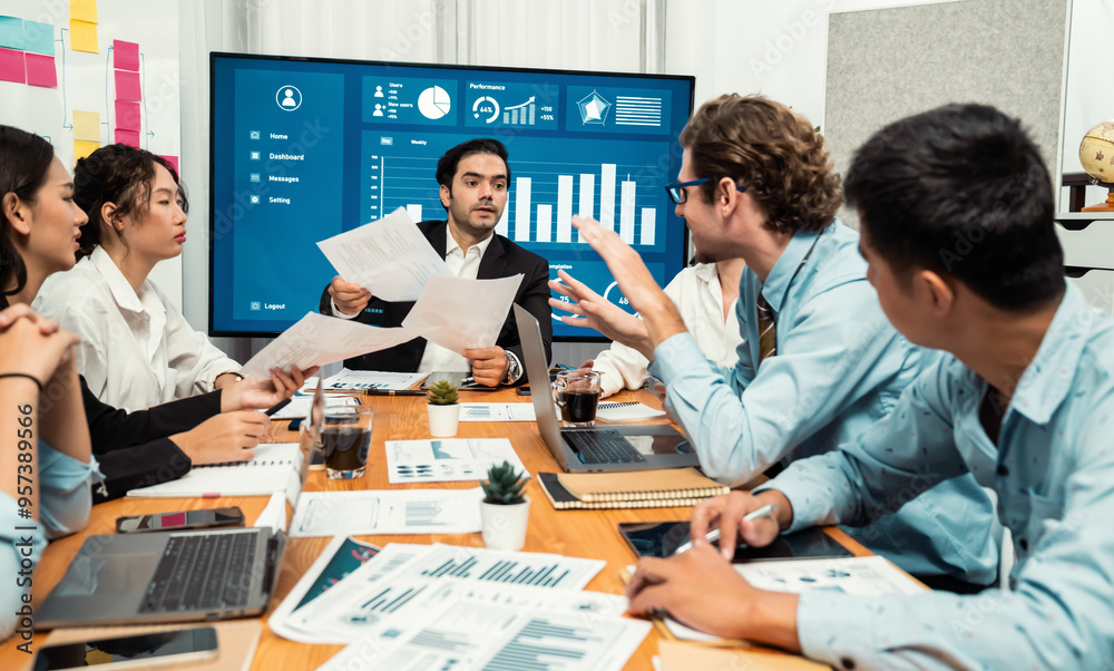 Diverse group of business analyst team analyzing financial data report. Finance data analysis chart and graph dashboard show on TV screen in meeting room for strategic marketing planning. Habiliment Diverse group of business analyst team analyzing financial data report. Finance data analysis chart and graph dashboard show on TV screen in meeting room for strategic marketing planning. Habiliment