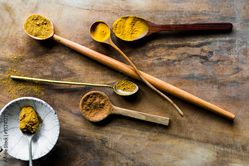 Raw food ingredient turmeric and powder spices photo