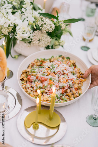 Appetizing salad garnished with cheese on decorative table. photo