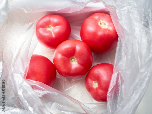 Fresh red tomatoes in a package close-up. Eco-friendly natural food