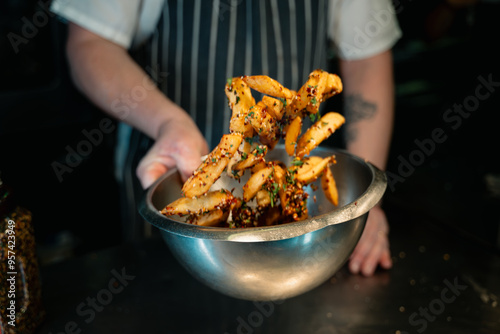 Foto Chips Fries Being Tossed with Seasoning with motion blur
