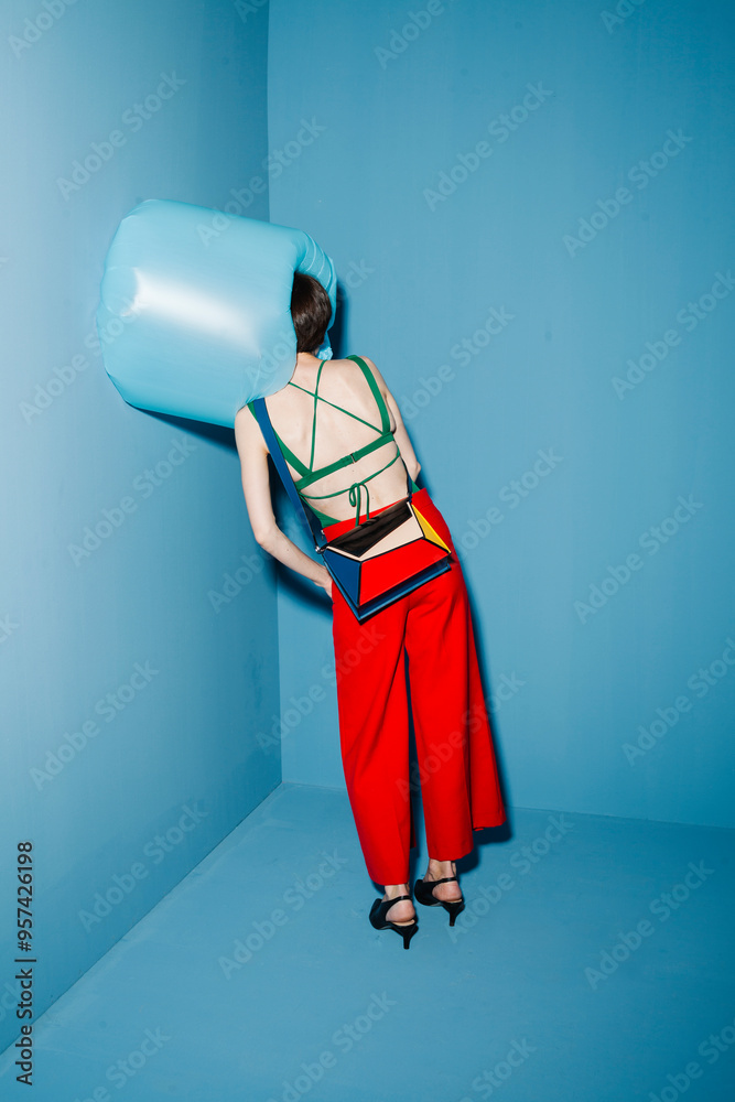 © Ulas&Merve/Stocksy - Futuristic Fashion Model in Colorful Geometric Design © Ulas&Merve/Stocksy - Futuristic Fashion Model in Colorful Geometric Design