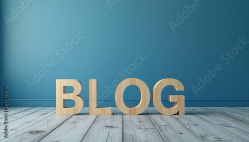 Wooden letters spelling 'BLOG' on a light wooden floor against a teal wall background.