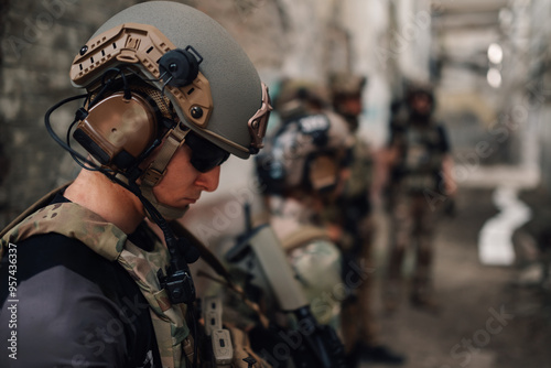 Close up of airsoft player with helmet on head preparing for action.