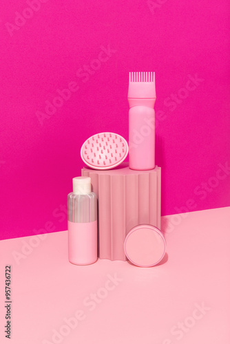 Aesthetic beauty product set on a vibrant pink and pastel background. photo