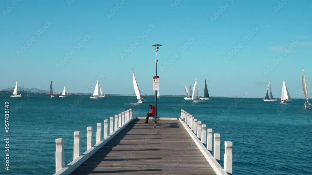 Melbourne, Australia Tourists strolling on a pier in Melbourne Melbourne, Australia Tourists strolling on a pier in Melbourne