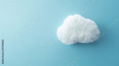 a fluffy white cloud-shaped cushion against an isolated soft baby blue background