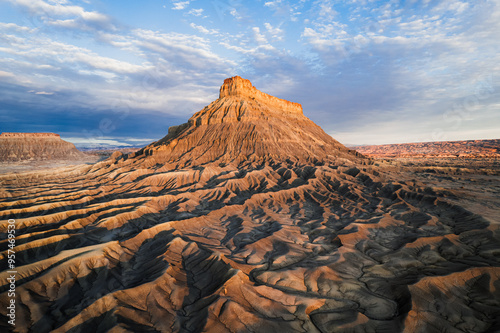 Factory Butte, massive ancient sandstone natural structure surrounding by incredible landscape .