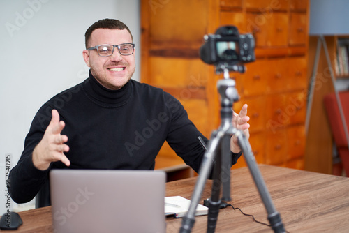 man filming video blog on camera with tripod for online followers. In social media, Influencer, new technology and internet concept