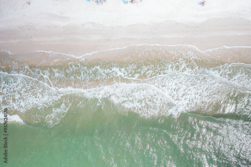 ocean waves calmingly rolling onto sandy beach ocean waves calmingly rolling onto sandy beach