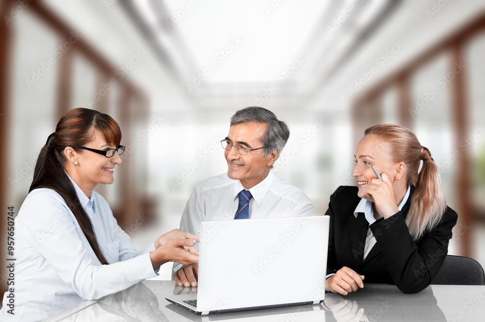 Two busy business people at work in office Two busy business people at work in office