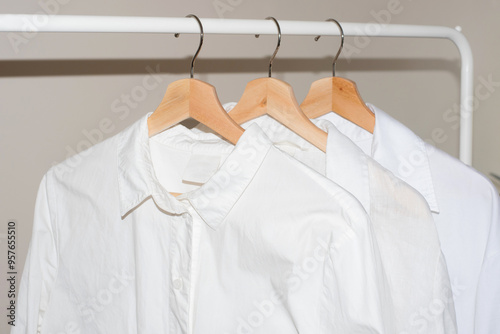 White shirts hanging on a rail
