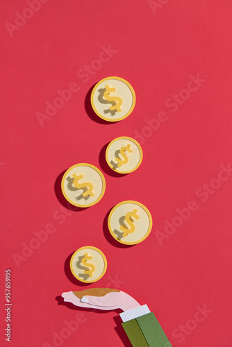 Hand Catching Dollar Coins On Red Background photo