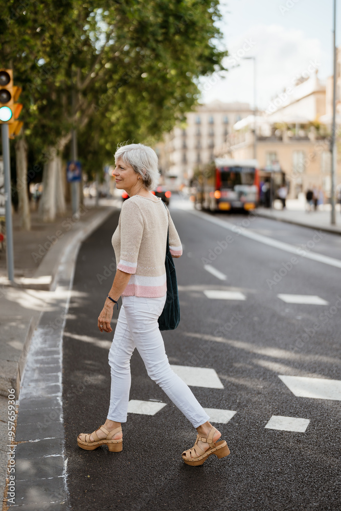 Woman enjoying a walk in the city on a sunny day Woman enjoying a walk in the city on a sunny day