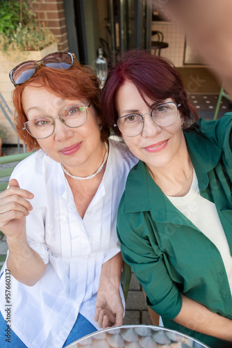 Wallpaper Mural Two Women Taking a Selfie at Outdoor Cafe
 Torontodigital.ca
