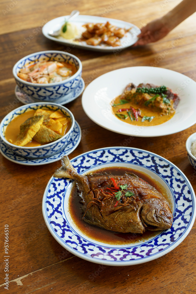 Southern Thai food on a wooden table Southern Thai food on a wooden table
