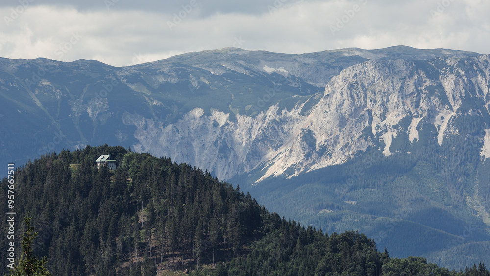 Panoramic view of big mountains with snow on top.