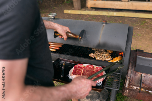 raw chicken cooking on smoker bbq grill