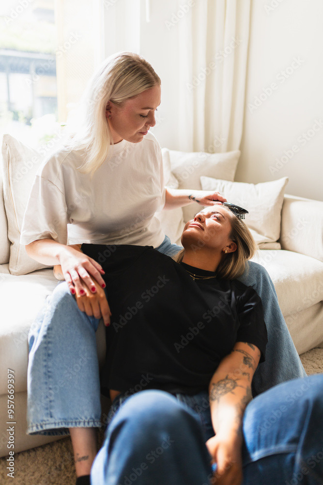 LGBT Woman Couple Enjoying Hair Brushing Session at Home LGBT Woman Couple Enjoying Hair Brushing Session at Home