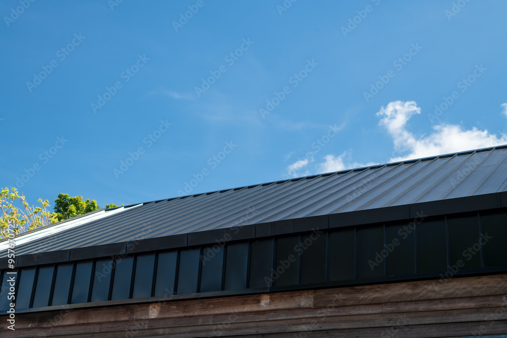Close up of roof with blue sky.