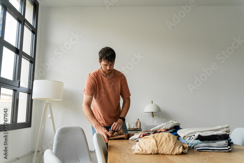 Man Folding Clean Clothes photo