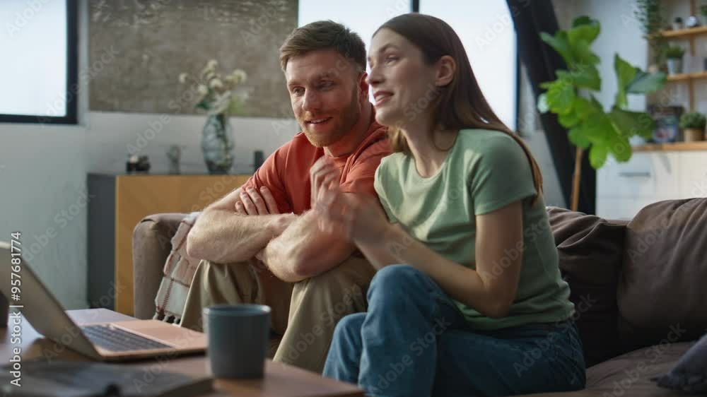 Smiling couple video calling sitting couch living room closeup. Happy spouses Smiling couple video calling sitting couch living room closeup. Happy spouses