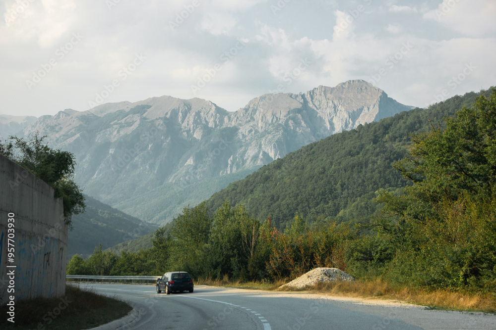 Fototapeta premium Beautiful road among mountains and forests