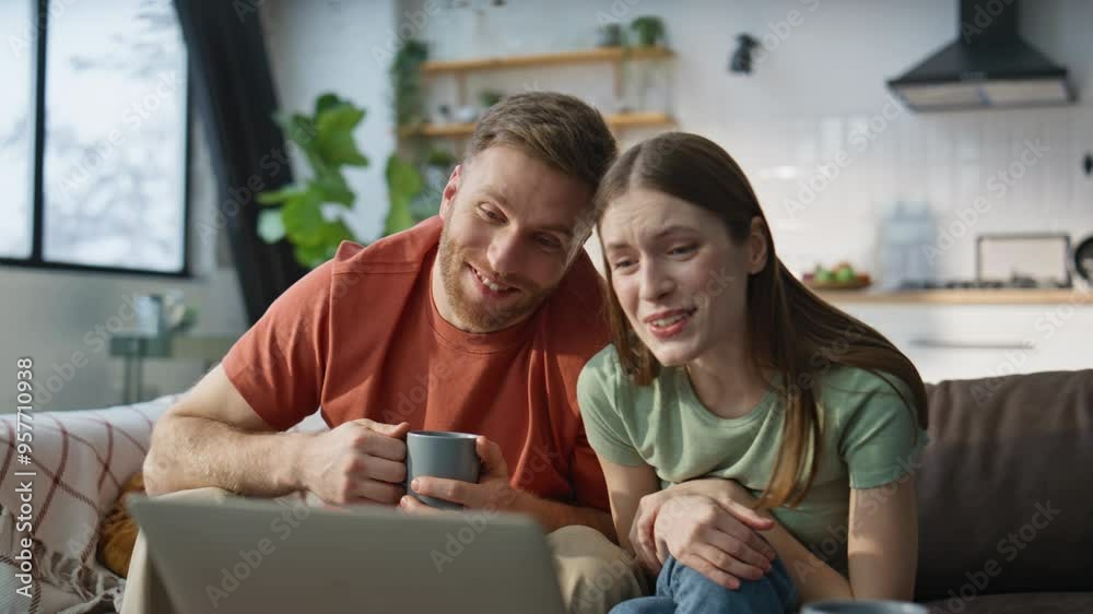 Spouses enjoy online meeting with family using laptop internet at home closeup Spouses enjoy online meeting with family using laptop internet at home closeup