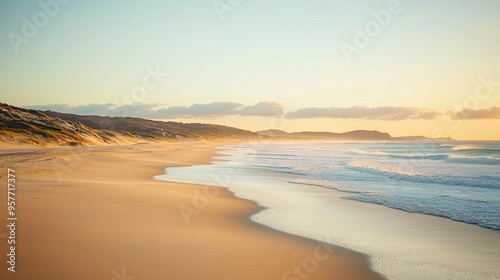 Serene Sandy Beach at Sunrise with Calm Sea