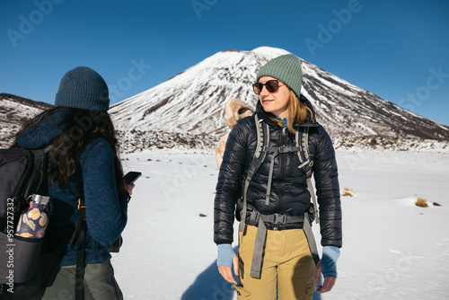 Women walking on the snow in Tongariro National Park photo