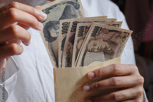 Counting Japanese Yen Banknotes: Person Taking Cash from Envelope