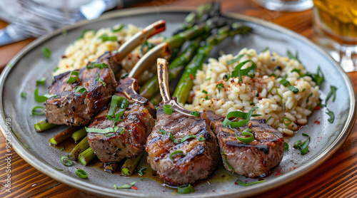 A plate of lamb chops and risotto