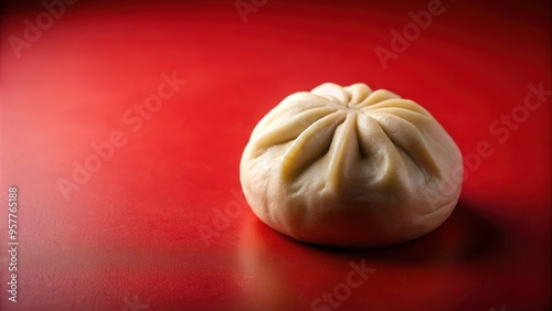 Chinese baozi or bakpao bun on a red background, Chinese cuisine, baozi, bakpao, bun, steamed, yeast-leavened, filled photo