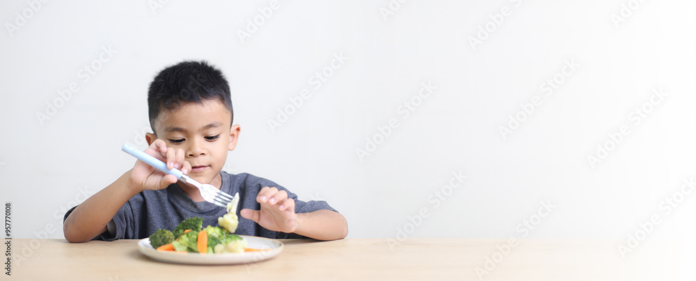 Nutrition healthy eating habits for kids concept. Children do not like to eat vegetables. Little cute boy refuses to eat healthy vegetables. Nutrition healthy eating habits for kids concept. Children do not like to eat vegetables. Little cute boy refuses to eat healthy vegetables.