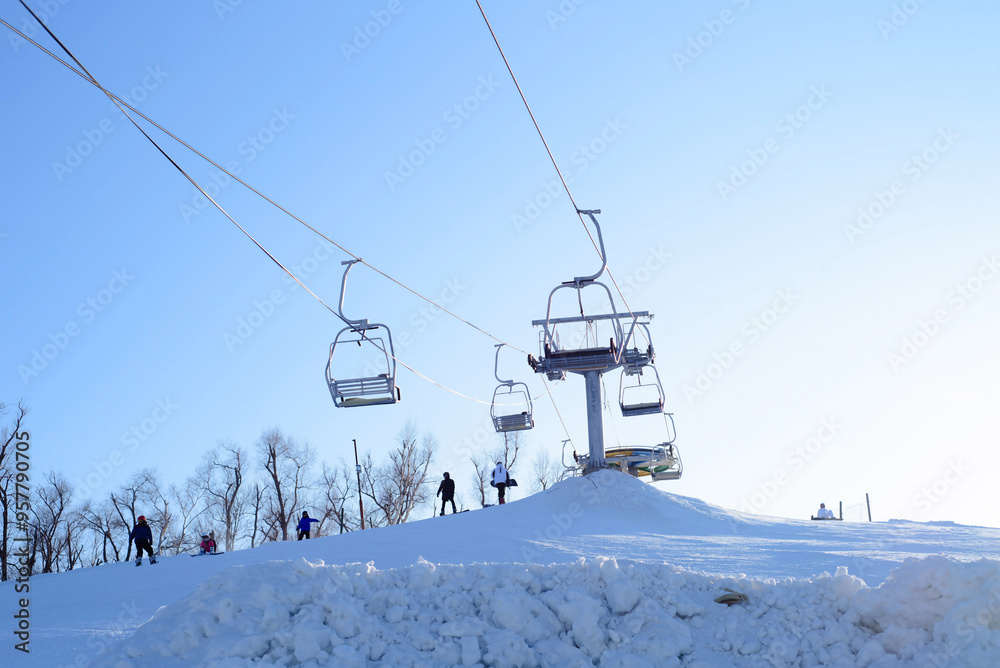 ski resort with ski lift against blue sky in winter ski resort with ski lift against blue sky in winter