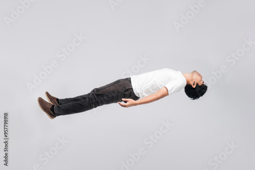 Canvas-taulu Asian man is floating in the air
