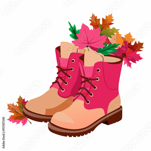 Colorful boots with autumn leaves arrangement in them on white background