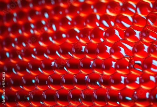 A close-up of bubble wrap illuminated by red light