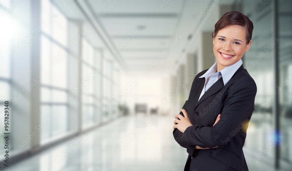 Happy professional business woman posing in office Happy professional business woman posing in office