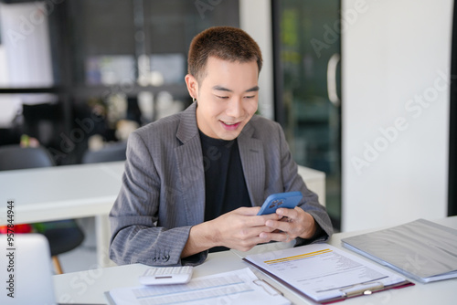 Asian Businessman with Smartphone working mobile devices cell telephone technology e-commerce smartphone business professional investor working new start up project