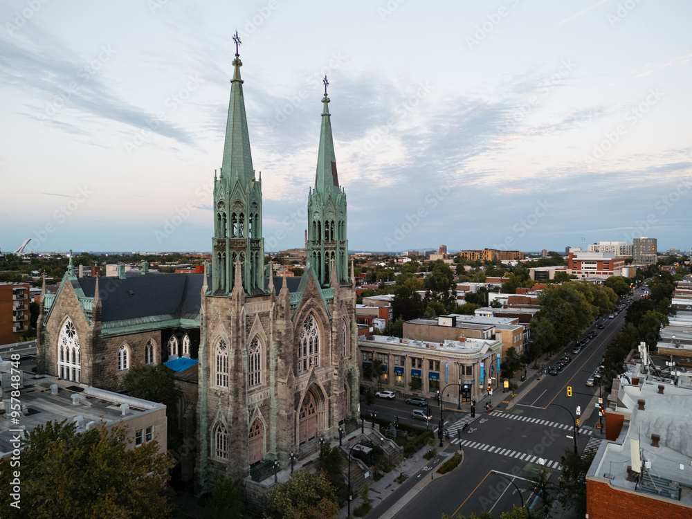 Drone view of Saint-Edouard Church is a Roman Catholic church in Montreal at the sunset, Quebec, Canada. Drone view of Saint-Edouard Church is a Roman Catholic church in Montreal at the sunset, Quebec, Canada.