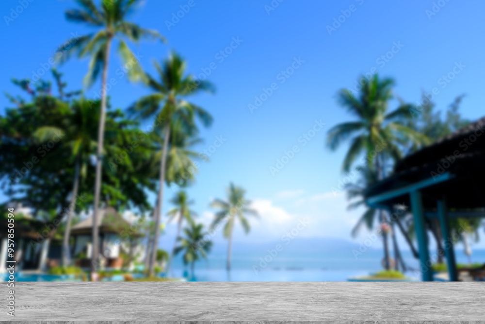Cement counter top There is a view of the swimming pool and sea in the background of the resort. A blurry garden of trees is visible. of decorative design ideas Cement counter top There is a view of the swimming pool and sea in the background of the resort. A blurry garden of trees is visible. of decorative design ideas