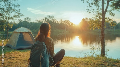 Asian women visit and camp by themselves in Thailand's natural parks. Outdoor recreation and travel with an active lifestyle. Greetings and happy beginning of the day. 