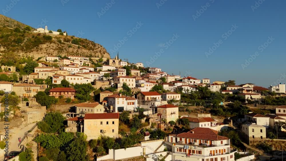 Dhermi, a charming ancient town in albania, nestled on a mountain slope, aerial view