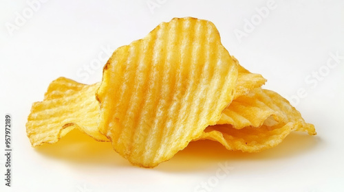 Delicious ridged potato chips on a white background, top view