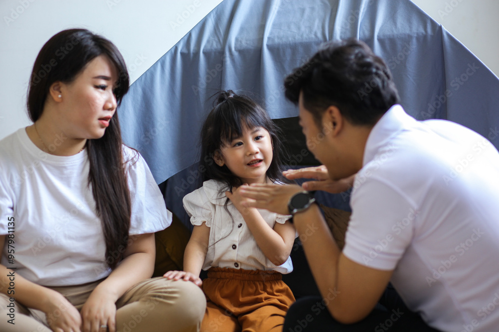 Funny Asian Family, Father Story Telling To Mother And Daughter Listening Funny Asian Family, Father Story Telling To Mother And Daughter Listening