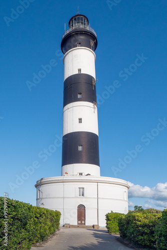 A tall lighthouse with a white and black exterior