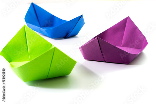 Paper colored boat isolated on white background. origami crafts. transport concept. origami.